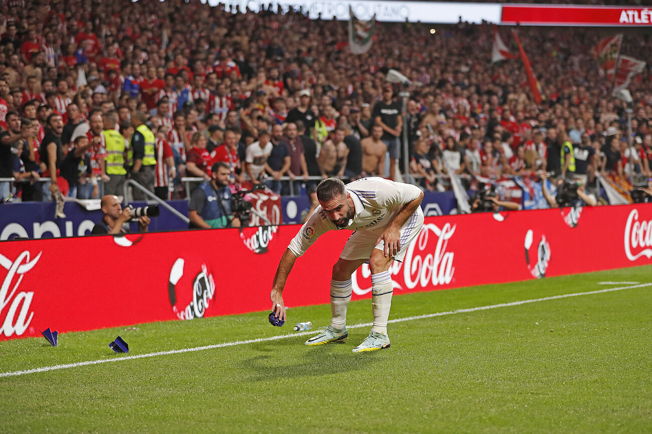 Real Madrid's Carvajal deflects the fans' projectiles