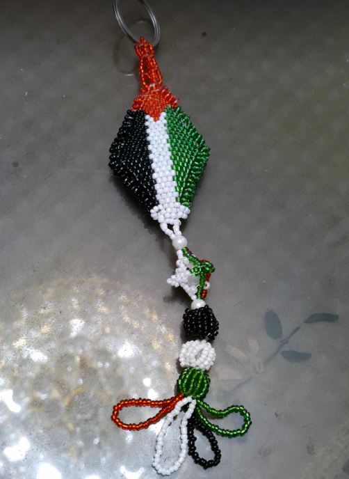 ميدالية على شكل علم فلسطين