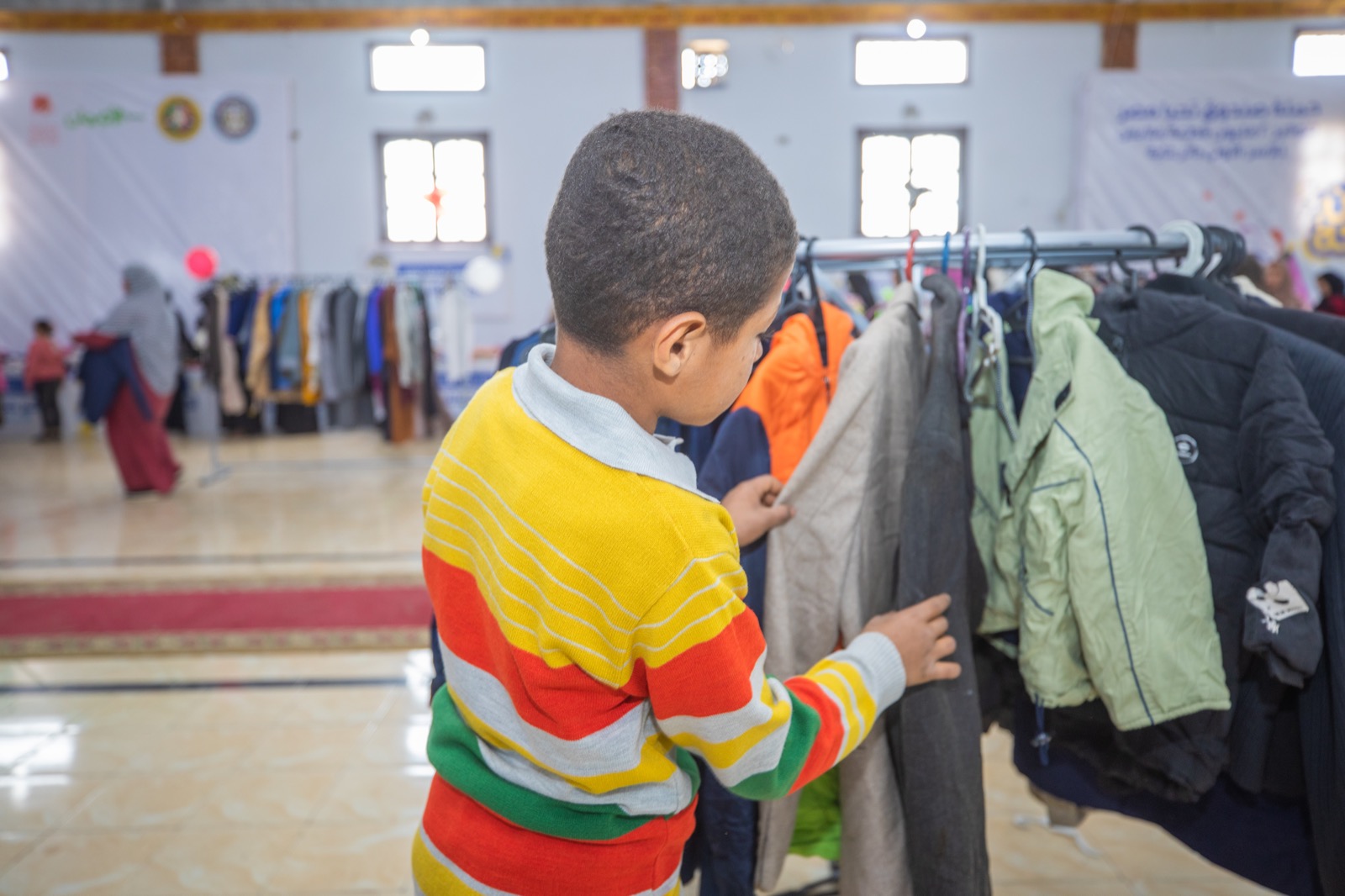 معارض دكان الفرحة  لصندوق تحيا مصر  توفر  25 ألف قطعة ملابس ل 2500 أسرة  4