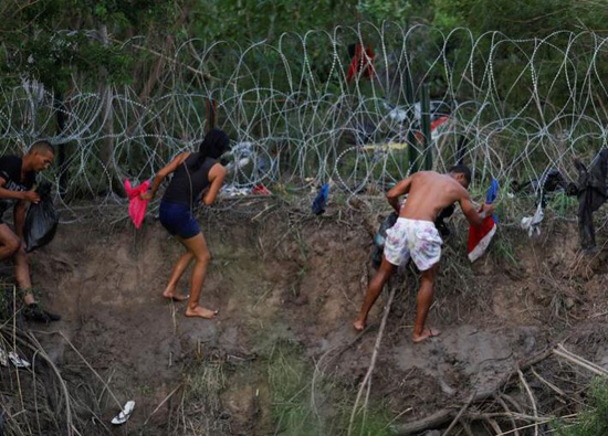 مهاجرون يتدفقون على الحدود الأميركية المكسيكية (6)