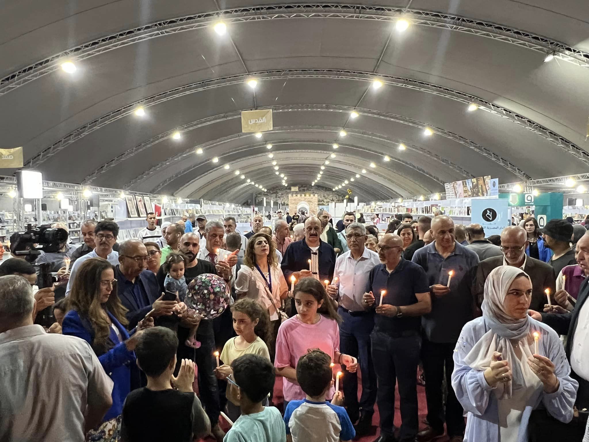وقفة بالشموع تضامنت مع شعب المغرب في معرض فلسطين للكتاب 2023