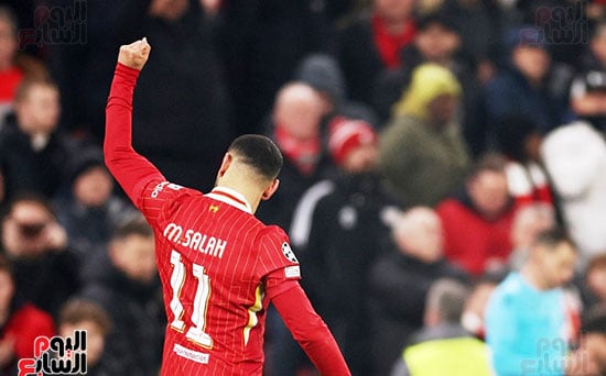 Mohamed Salah celebrates with the audience