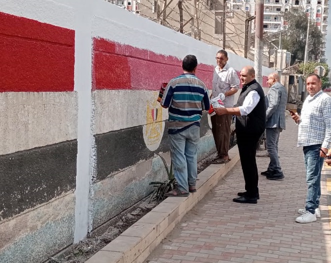 رسم علم مصر على جدران المصالح الحكومية احتفالا بالعيد القومي لمحافظة كفر الشيخ
