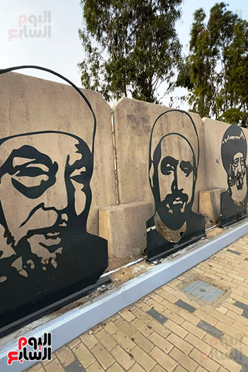 الشعراوى والبابا شنودة على جرافيتى بالطريق المؤدى للمتحف الكبير (1)