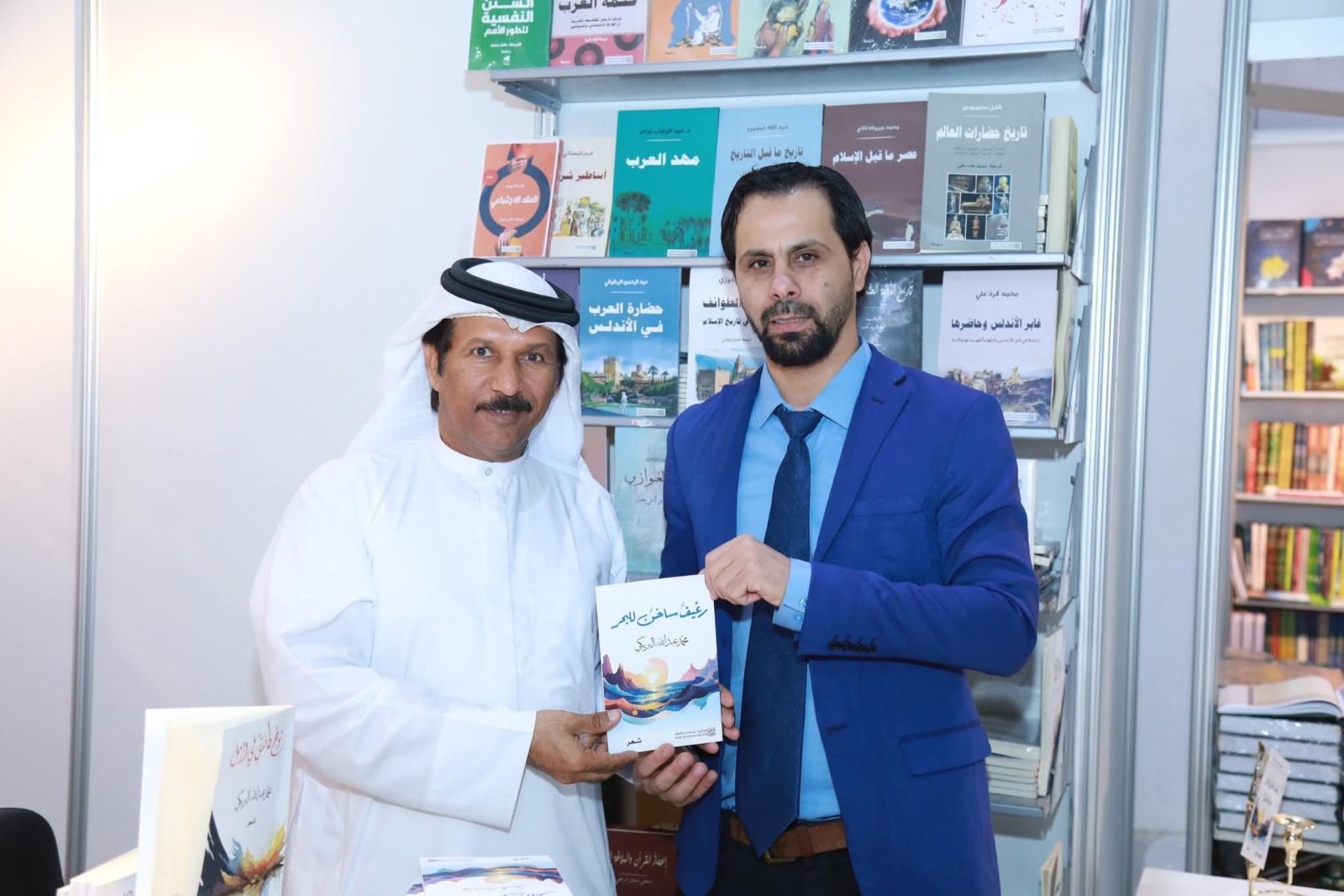 الشاعر محمد البريكى والدكتور محمد طه العثمان