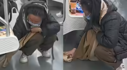 سيدة صينية تنظف المترو بوشاحها سيدة صينية تنظف المترو بوشاحها