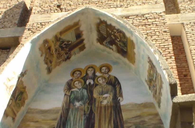 Expressive picture of the mum of Dolgi and her four sons on the church building Expressive picture of the mum of Dolgi and her four sons on the church building