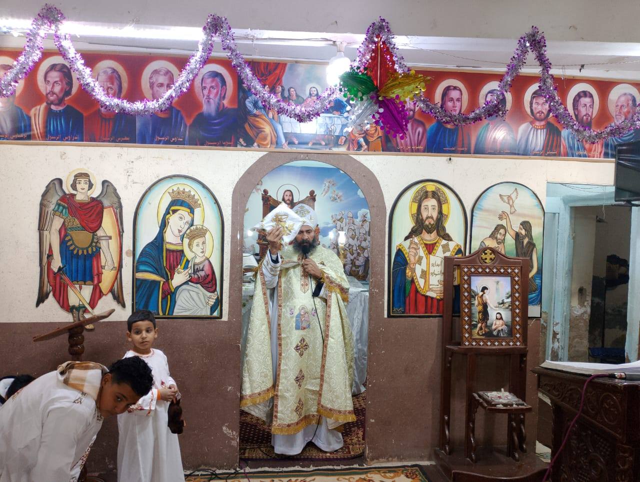 جانب من لقان عيد الغطاس بكنيسة رئيس الملائكة ميخائيل بعزبة جاد