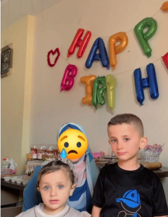 زوجة الشهيد أحمد مصطفى وأبنائها