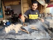 شوى السمك فى السوق