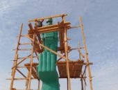 دهان تمثال أم البطل فى أسيوط