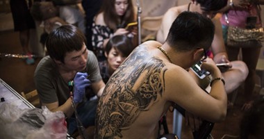 بالصور.. مهرجان "التاتو" فى بكين يثبت شعبيته عند الصينيين واليابانيين