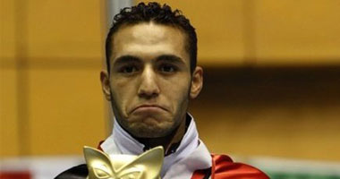 بطل الملاكمة يعود من الدوحة حاملا تذكرة أولمبياد البرازيل وسط استقبال أسطورى