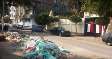 تراكم أكوام القمامة أمام مدرسة جيهان السادات الثانوية بالروضة