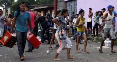 أعمال سلب ونهب فى فنزويلا عقب احتجاجات لنقص السيولة النقدية