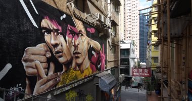 بالصور.. جرافيتى "بروس لى" على جدران هونج كونج فى شهر الفنون السنوى