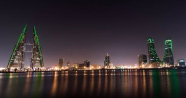 بالصور.. البحرين تكتسى باللون الأخضر احتفالا باليوم الوطنى السعودى