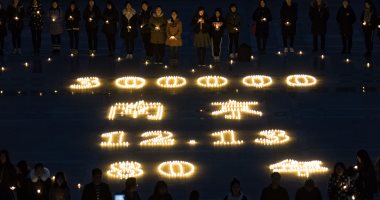 صور ..طلاب يحيون الذكرى الـ80 لمذبحة نانجينج فى الصين