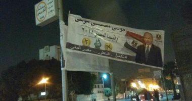 حملة موسى مصطفى موسى تعلق لافتات الدعاية فى شوارع القاهرة.. صور