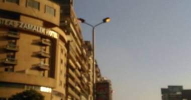 قارئ يرصد إضاءة أعمدة الكهرباء نهارا فى شارع جامعة الدول بالمهندسين