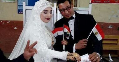 صور.. عروسان يدليان بصوتهما فى الانتخابات الرئاسية بشبرا الخيمة 