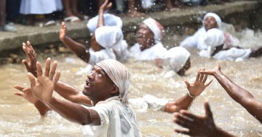 صور.. احتفالات مرعبة لمعتنقى ديانة السحر الأسود بجزر هايتى