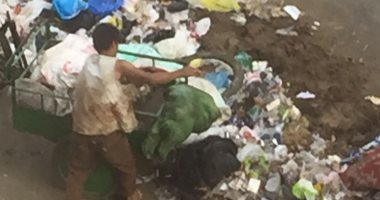 قارئ يشكو من تراكم القمامة بشارع النيل الأبيض بالجيزة