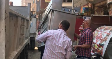 حملات لرفع الإشغالات بأحياء الجيزة والتحفظ على سيارة تلقى مخلفات بشوارع بولاق