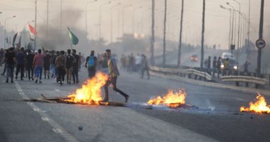 صدامات بين المتظاهرين والقوات الأمنية قرب نفق التحرير فى العاصمة بغداد 