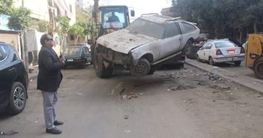 حملات لمصادرة السيارات المتهالكة فى أحياء القاهرة.. صور
