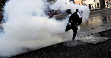 صور.. اشتباكات بين الشرطة والمتظاهرين فى تشيلى