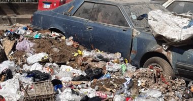 صور.. القمامة والسيارات المتهالكة تشوه شارع جلال الدين الحمامصى بالعجوزة 