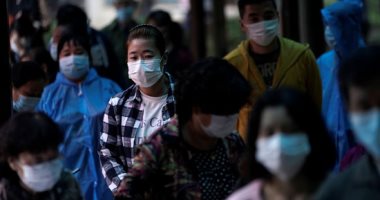 فريق تحقيق منظمة الصحة العالمية يزور مختبرا للفيروسات فى ووهان بالصين