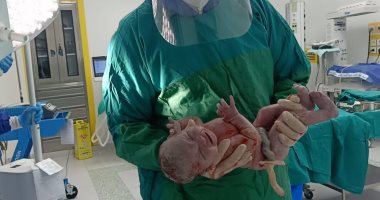 مستشفى إسنا تنجح فى إجراء جراحة ولادة لمصابة بفيروس كورونا.. صور