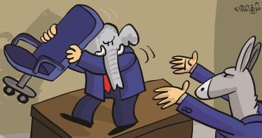 الفيل والحمار يتصارعان على كرسى حكم الولايات المتحدة فى كاريكاتير إماراتى