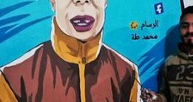 قارئ يشارك بصور رسمه "حسام بوجى" على حائط منزله