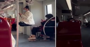 حركة غريبة وصادمة.. روسية تتعلق بشعرها فى عربة قطار "فيديو"