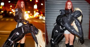 جوليا فوكس تحمل حقيبة على هيئة إنسان بأسبوع الموضة فى نيويورك