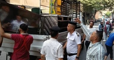 إزالة 320 حالة إشغال للمحال والمقاهى خلال حملة فى العمرانية.. صور