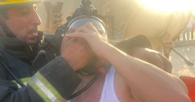 الحماية المدنية تنقذ شخصا وسيدة من حريق شقة فى جسر السويس ..صور