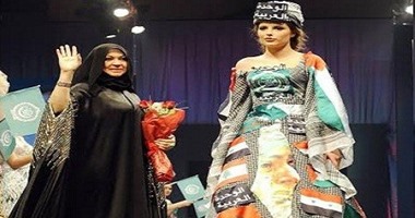 مصممة أزياء إماراتية تصمم فستانا يشير إلى الوحدة العربية