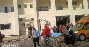 قوات الأمن تنقل جثة شهيد لمستشفى العريش العسكرى