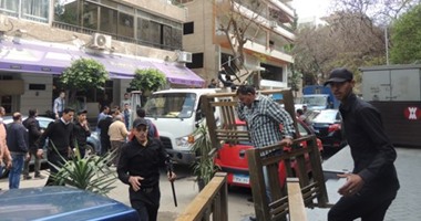 قوات الأمن بالجيزة تزيل عشرات الأكشاك غير المرخصة فى الشوارع