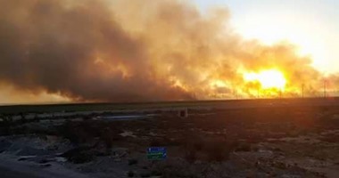 قارئ "اليوم السابع" يرسل صور حريق هائل بملاحات الطريق الدولى الساحلى