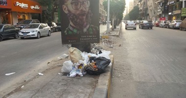 بالصور.. القمامة تغزو شارع لبنان بالمهندسين بالتزامن مع حملة "حلوة يا بلدى"