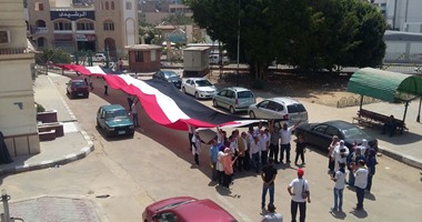 الكشافة البحرية بالسويس تنظم مسيرة بأعلام مصر احتفالا بالقناة الجديدة