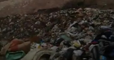 صحافة المواطن..انتشار القمامة أسفل الطريق الدائرى بـ"سلم الفيلا"فى الجيزة