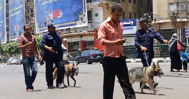 بالفيديو.. الأمن يمشط ميدان التحرير بـ"كلاب بوليسية" بعد انفجارات "الاتحادية"