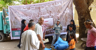 بالصور.. "اليابانية" توزع 50 طنا من القمح على الأسر الفقيرة بقنا