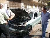 عناصر"الإخوان" يشعلون النار فى إحدى السيارات بشارع السوق فى حلوان